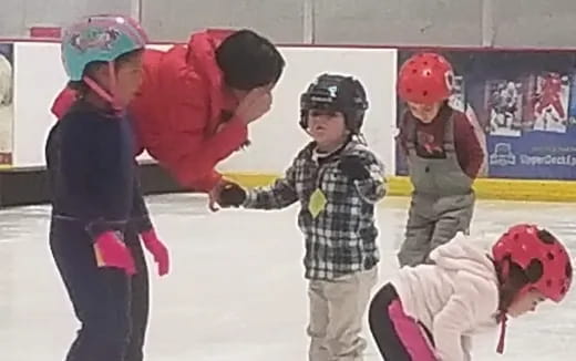 a group of kids wearing helmets