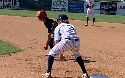 a baseball player running to first base