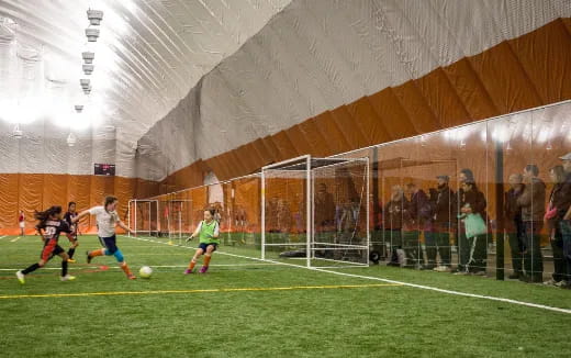 a group of people play football