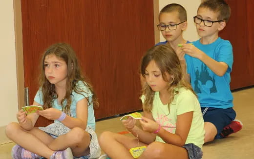 a group of children sitting on the floor