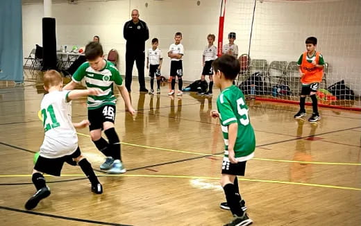 a group of kids playing a sport