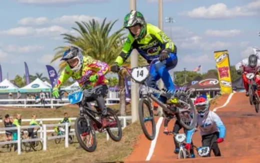 a group of people riding bikes