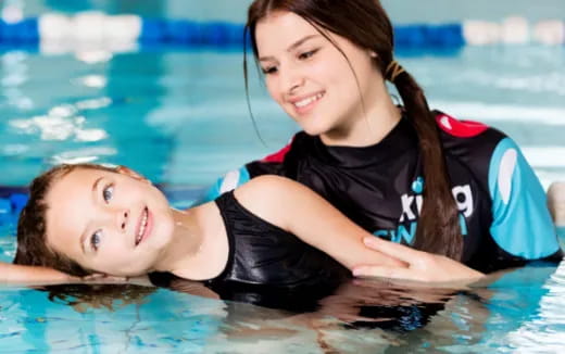 a man and woman in a pool
