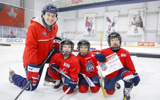a group of people playing hockey