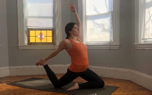 a woman doing yoga in a room
