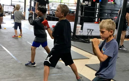 a group of boys playing with a rope