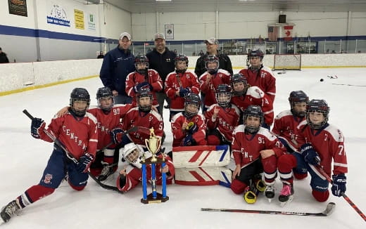 a group of hockey players posing for a photo