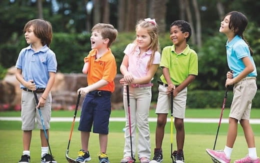 a group of kids holding sticks