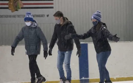 a group of people ice skating