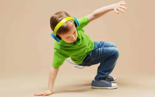 a young boy wearing a headband