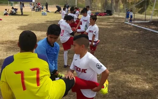 a group of boys playing football