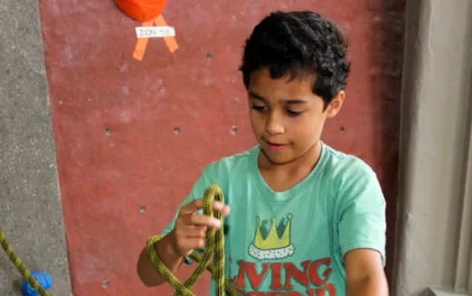 a boy holding a toy