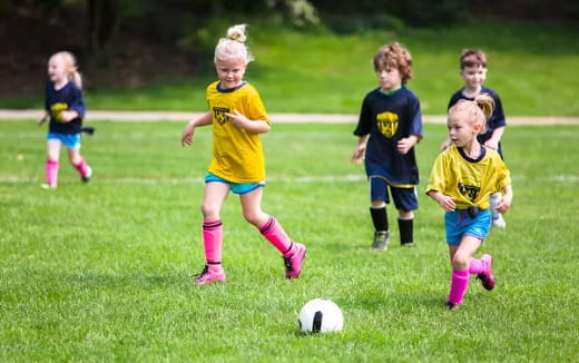 kids playing football on a field