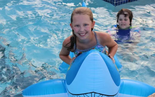 a couple of girls in a pool
