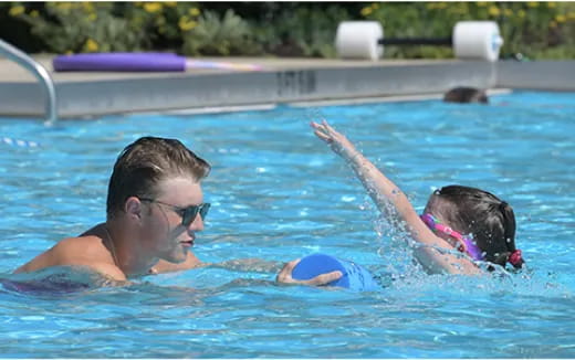 a man and a woman in a pool
