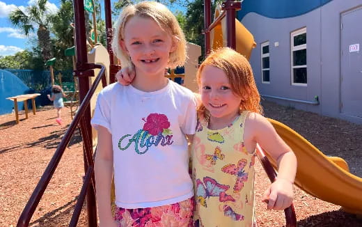 two girls standing next to each other