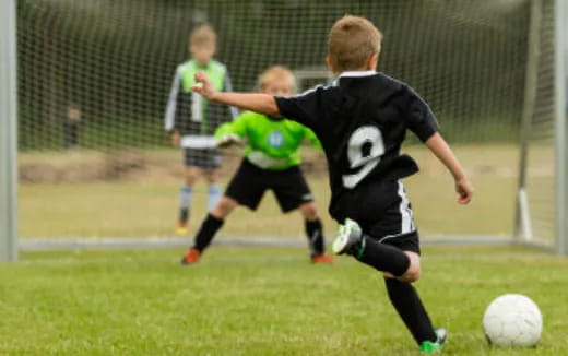 kids playing football on a field