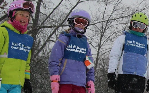 a group of people wearing helmets and goggles