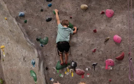 a man climbing a rock wall
