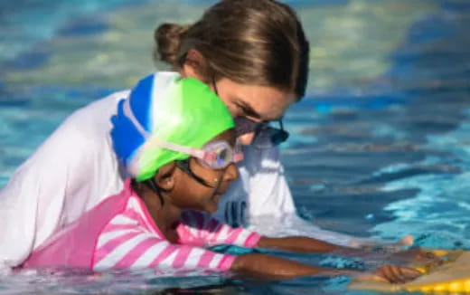 a couple of women in the water
