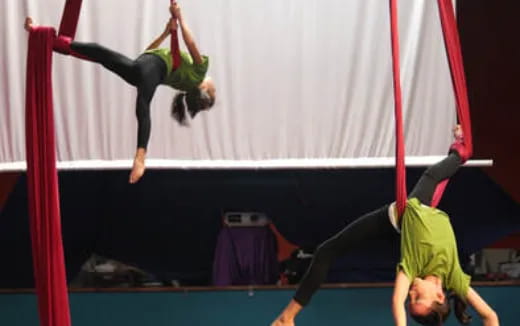 a group of people performing gymnastics