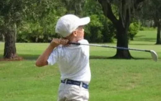 a man swinging a golf club