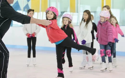 a group of people on ice skates