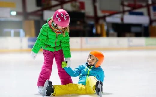 a person and a child ice skating
