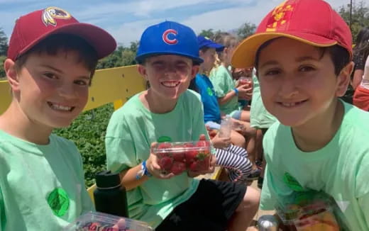 a group of kids wearing matching outfits