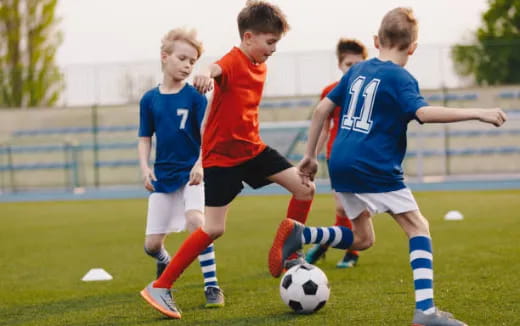 a group of boys playing football
