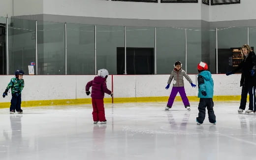 a group of people on an ice rink