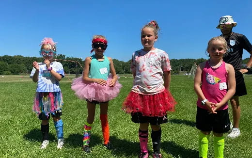 a group of girls wearing clothing