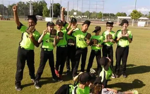 a group of people in green shirts