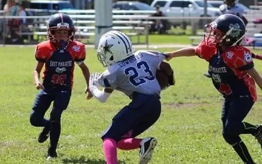 a group of people playing football