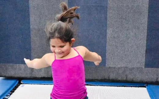 a girl with her hair in the air