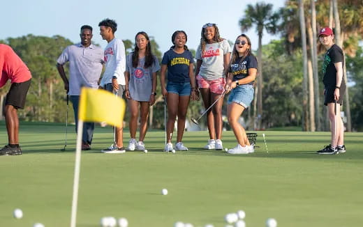 a group of people playing golf