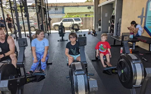 a group of people sitting on treads in a garage