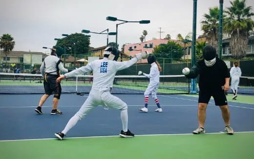 a group of people playing baseball