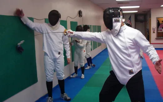 a group of people in white uniforms