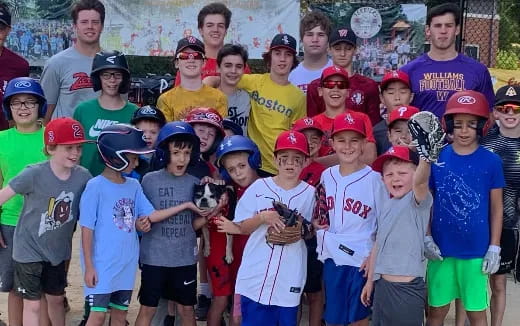 a group of kids wearing baseball gear