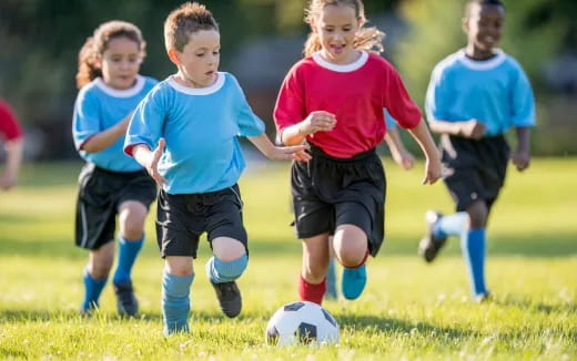 kids playing football on a field
