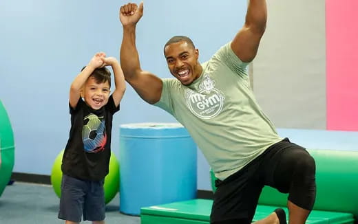 a person and a child posing for the camera