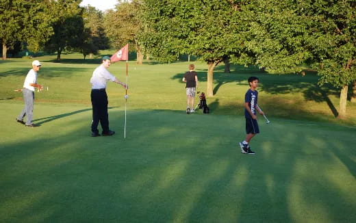 a group of people playing golf