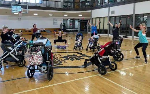 a group of people in a gym