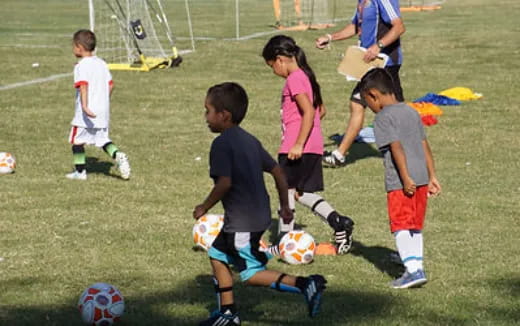 kids playing football on a field