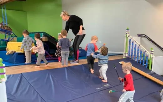 a group of children playing ping pong