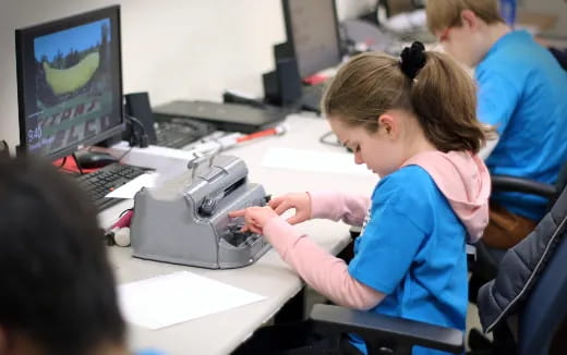 a group of people working on computers