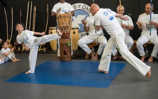 a group of people in karate uniforms