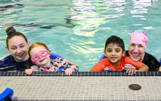 a group of people in a pool