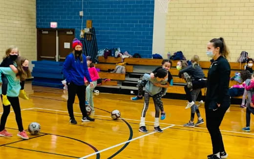 a group of kids playing football